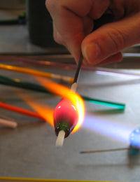 Becky Congdon shaping and forming a bead in the flame