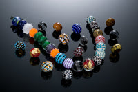 Various flameworked glass beads by Becky Congdon.