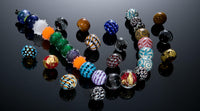Various flameworked glass beads by Becky Congdon.