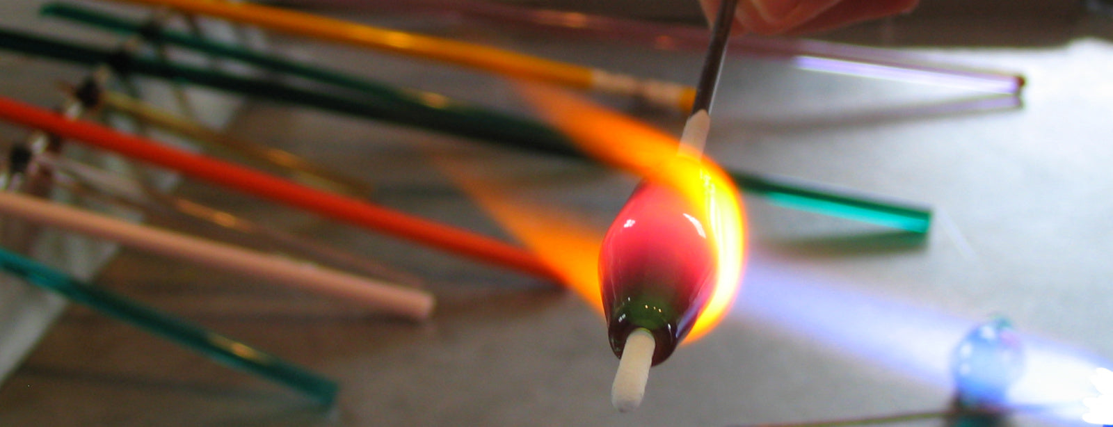 Becky Congdon shaping and forming a bead in the flame