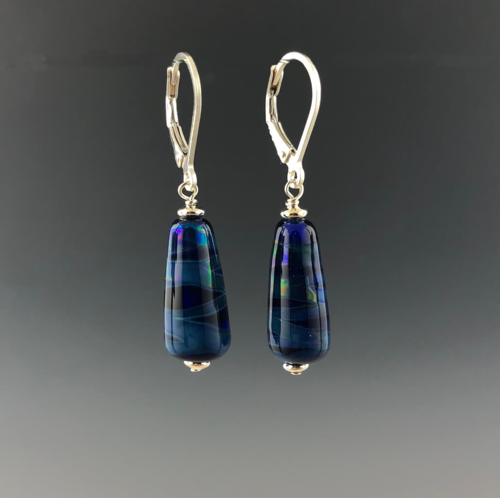 Side view showing opening of the leverbacks with sterling silver saucer beads and tapered cone cobalt blue dangle earrings.