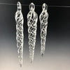 Crystal clear tapered icicles with clear and thin white twist. The three icicles show the different lengths.