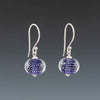 Ink Blue Sparkling Earrings (Ear Wires) by Becky Congdon are handmade glass beads of ink blue (light purple blue) glass with small silver balls encased with clear glass. The beads dangle from silver Bali ear wires with tiny silver saucers on either side of the bead.