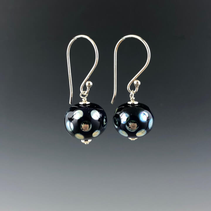 Side view of the silver Bali earwires with the cobalt blue  and shiny reflective mirrored dot beads dangling.